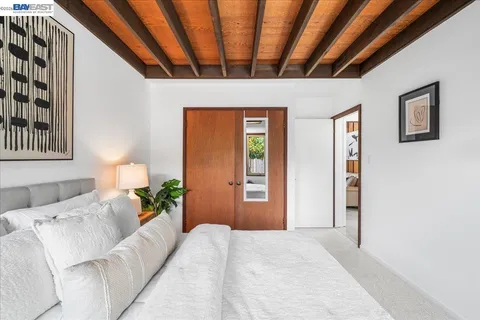 a bedroom with furniture and window