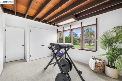 a view of hall way with furniture