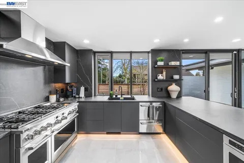 a kitchen with a stove and a sink