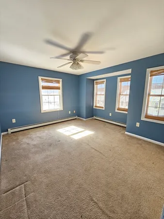 a view of an empty room with windows