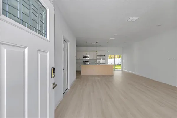 a view of a kitchen with wooden floor