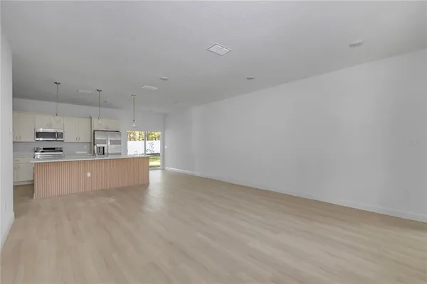 a view of kitchen with wooden floor