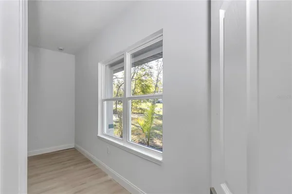 a view of an empty room with a window