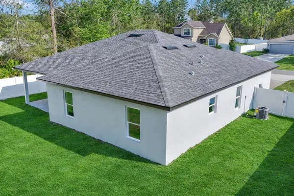 a aerial view of a house with a yard
