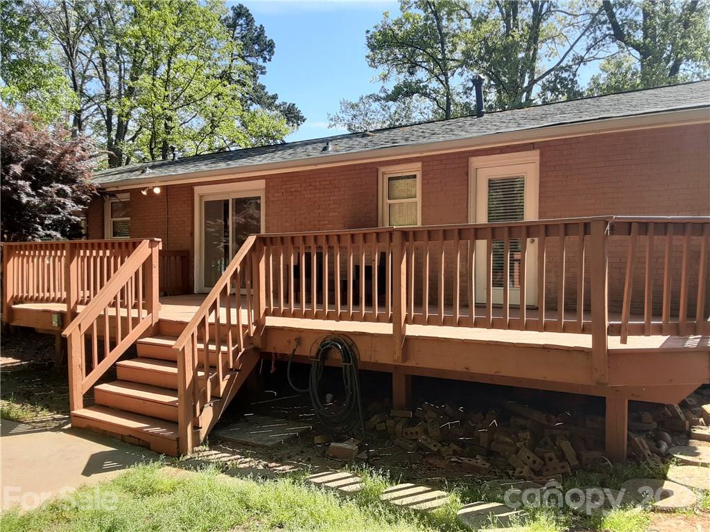 1501 Tyvola Road Charlotte, NC 28210 - Photo 12 of 20 a view of a house with backyard and deck