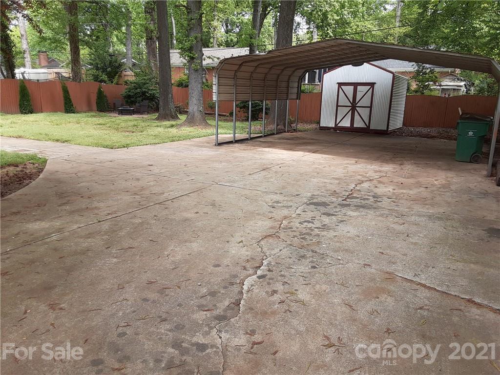 1501 Tyvola Road Charlotte, NC 28210 - Photo 20 of 20 a view of a house with backyard and a tree