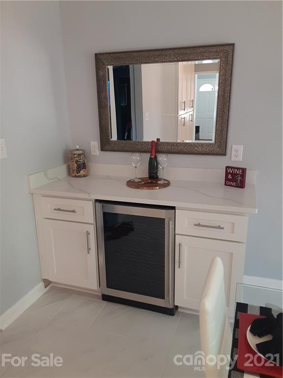 1501 Tyvola Road Charlotte, NC 28210 - Photo 5 of 20 a bathroom with a sink and a mirror