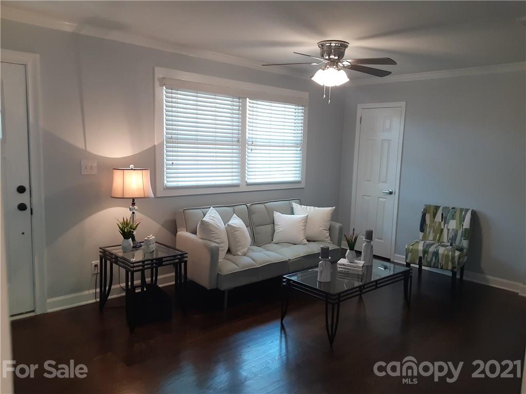 1501 Tyvola Road Charlotte, NC 28210 - Photo 6 of 20 a living room with furniture and a large window