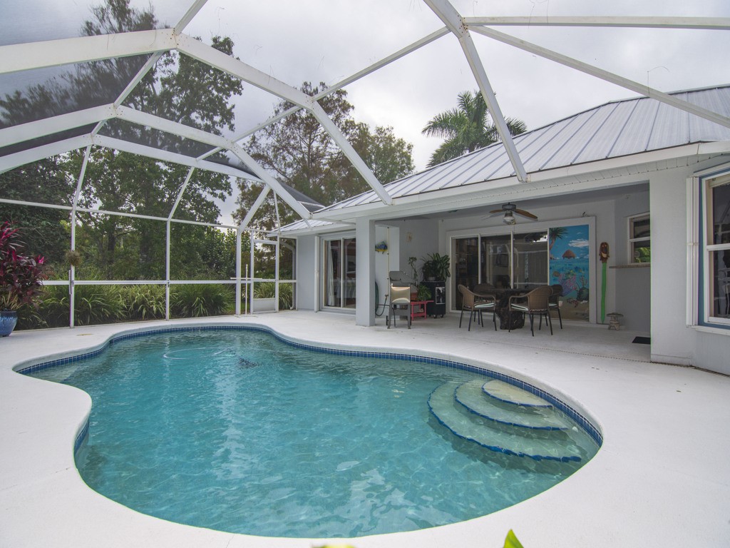 109 Thunderbird Drive Sebastian, FL 32958 - Photo 16 of 27 a view of a swimming pool with a patio