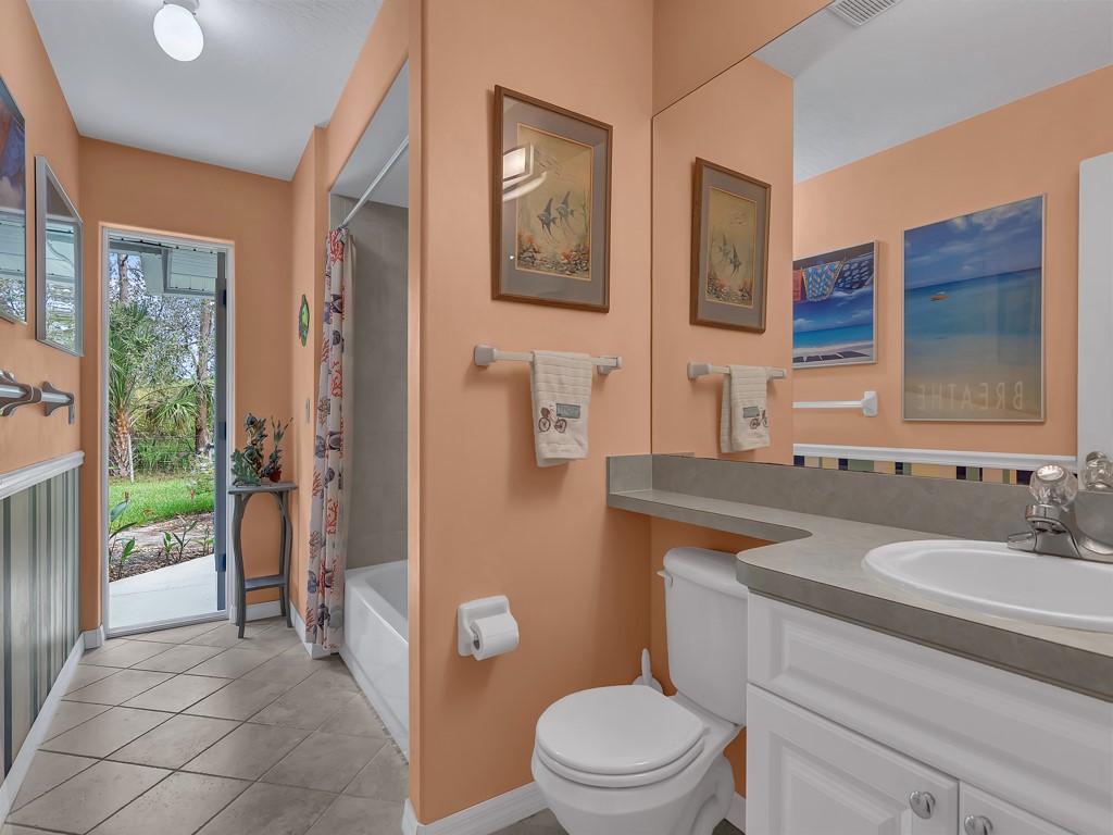 109 Thunderbird Drive Sebastian, FL 32958 - Photo 21 of 27 a bathroom with a sink a toilet and shower