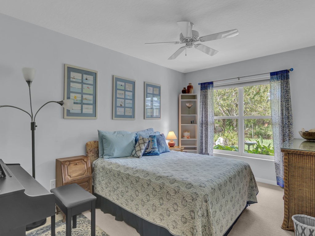 109 Thunderbird Drive Sebastian, FL 32958 - Photo 22 of 27 a bedroom with a large bed and a window