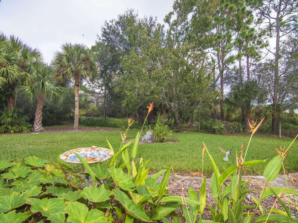 109 Thunderbird Drive Sebastian, FL 32958 - Photo 24 of 27 a view of a table and chairs in a garden