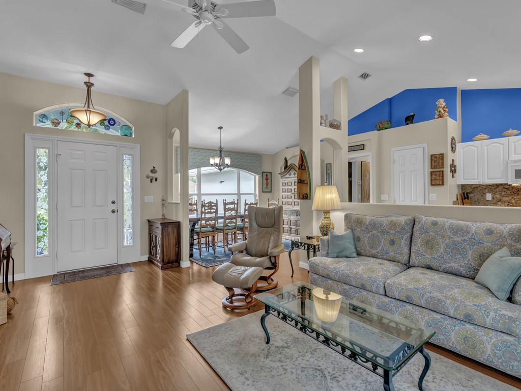 109 Thunderbird Drive Sebastian, FL 32958 - Photo 3 of 27 a living room with furniture and kitchen view