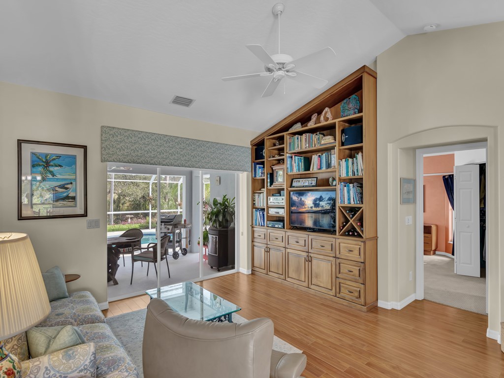 109 Thunderbird Drive Sebastian, FL 32958 - Photo 5 of 27 a living room with furniture a rug and a large window
