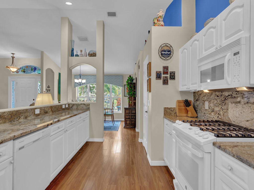 109 Thunderbird Drive Sebastian, FL 32958 - Photo 9 of 27 a kitchen with granite countertop a sink and cabinets