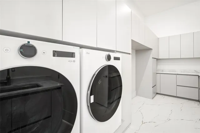 a kitchen with stainless steel appliances kitchen island granite countertop a sink and cabinets