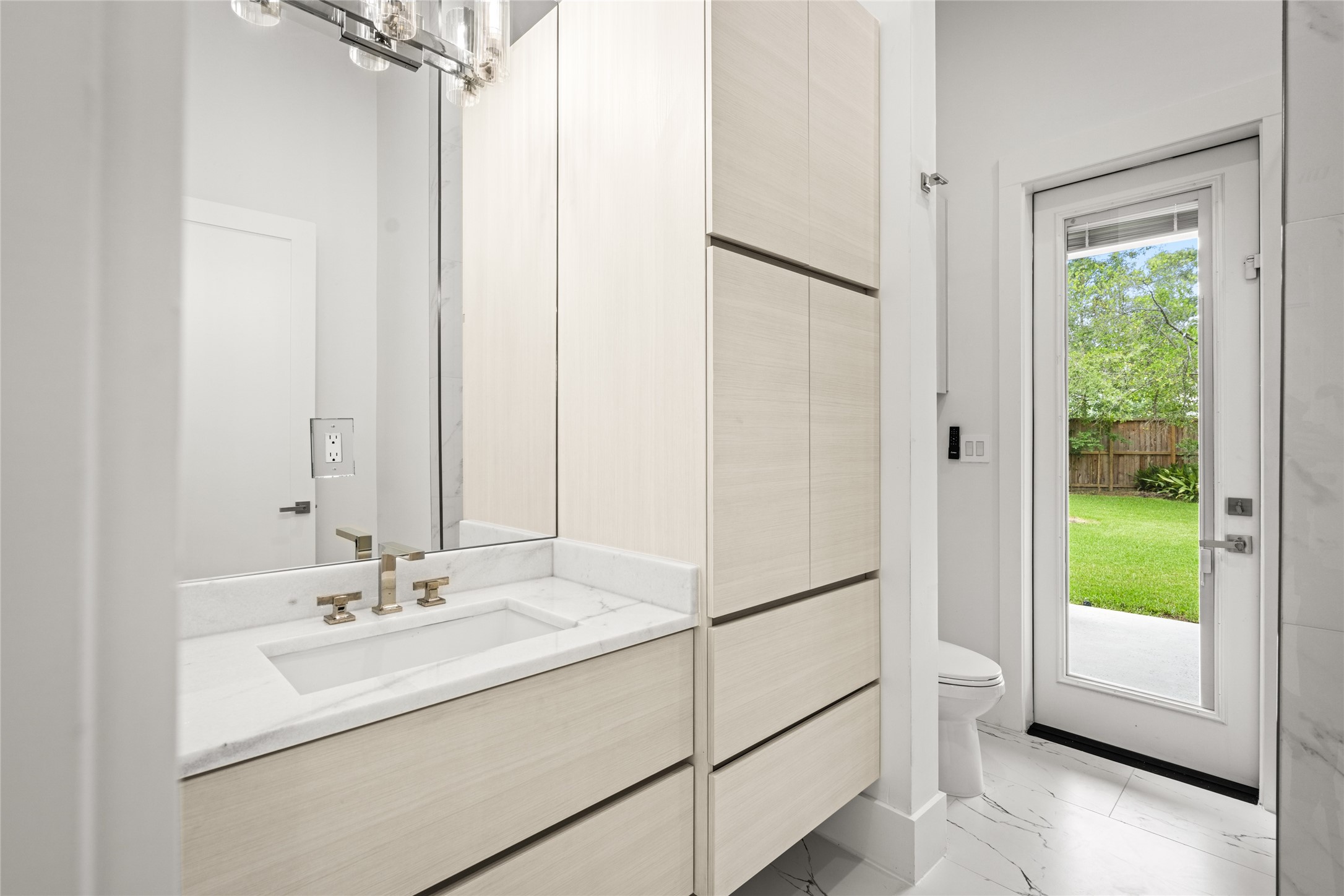 625 Piney Point Road Houston, TX 77024 - Photo 39 of 47 a bathroom with a sink and a mirror