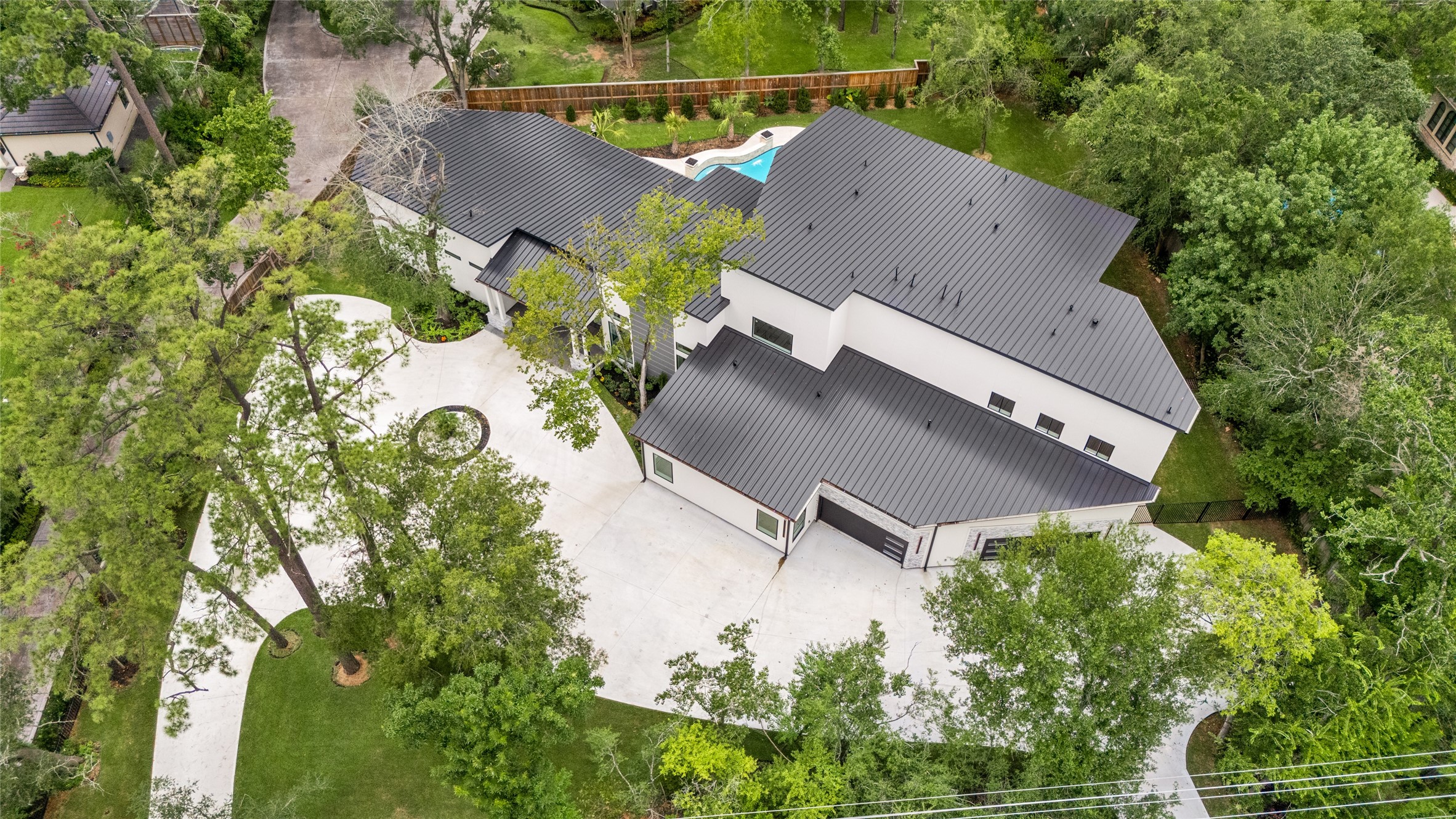 625 Piney Point Road Houston, TX 77024 - Photo 43 of 47 an aerial view of a house with outdoor space and trees all around