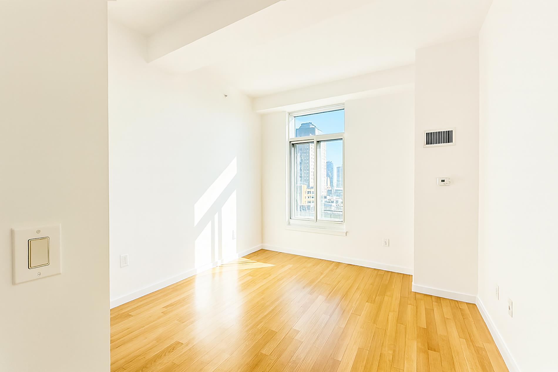 Undisclosed Address Brooklyn, NY 11201 - Photo 16 of 23 a view of an empty room with a window