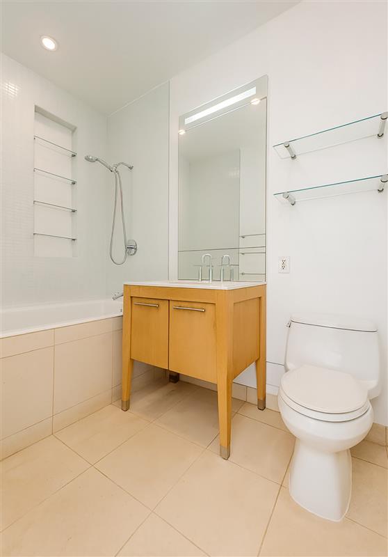 Undisclosed Address Brooklyn, NY 11201 - Photo 4 of 23 a bathroom with a sink a toilet and a shower