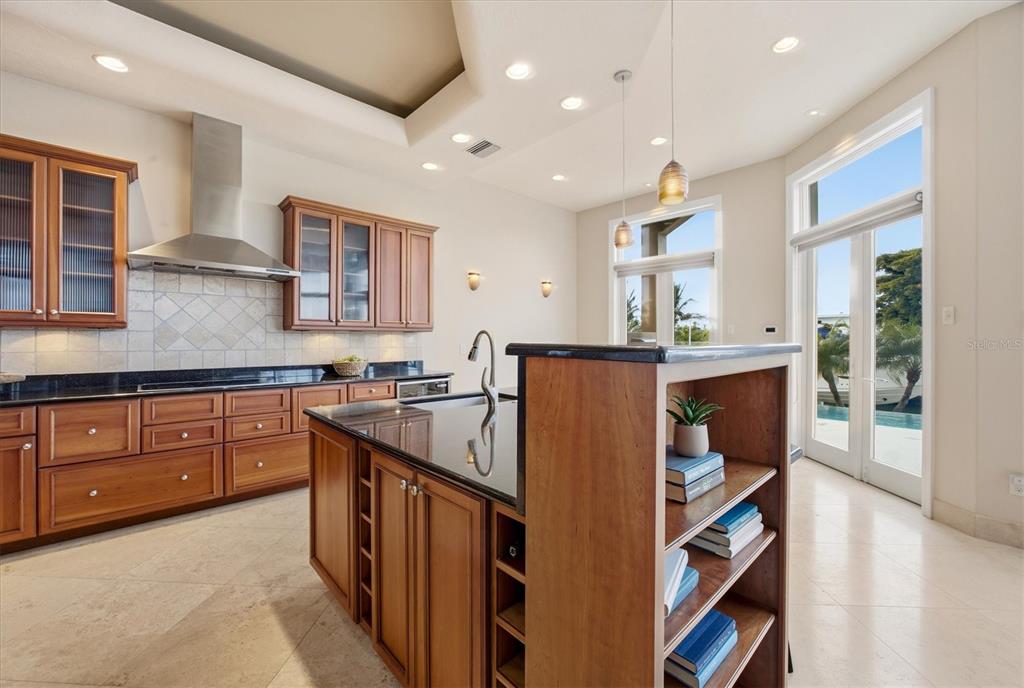 761 Norton Street Longboat Key, FL 34228 - Photo 22 of 66 a kitchen with stainless steel appliances granite countertop a sink and a stove