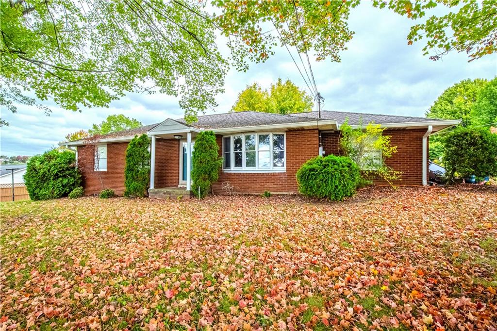front view of a house with a garden