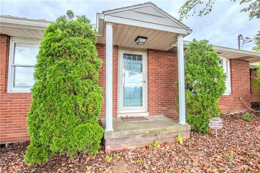 7 Lydia Drive Uniontown, PA 15401 - Photo 3 of 47 a front view of a house with garden