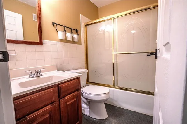 a view of an empty room with stairs