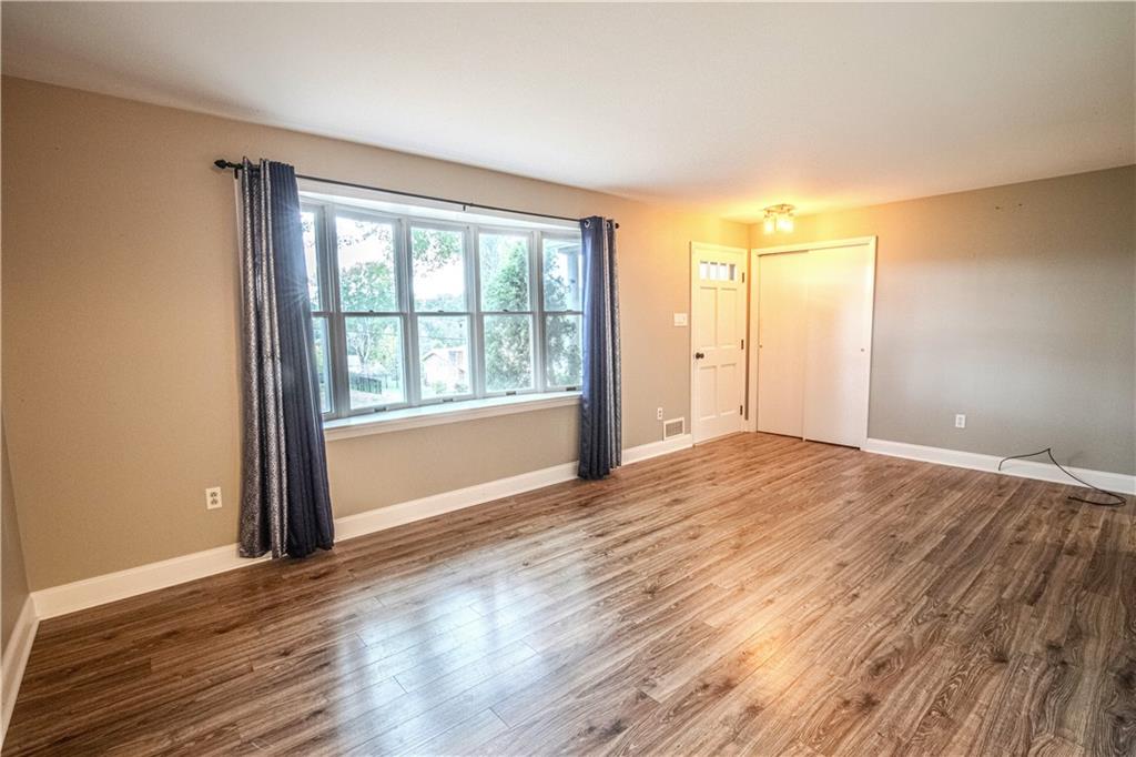 7 Lydia Drive Uniontown, PA 15401 - Photo 7 of 47 a view of an empty room with wooden floor and a window