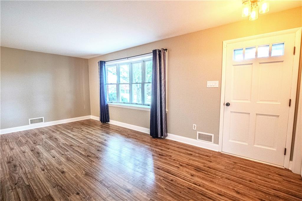 7 Lydia Drive Uniontown, PA 15401 - Photo 8 of 47 a view of an empty room with wooden floor and a window