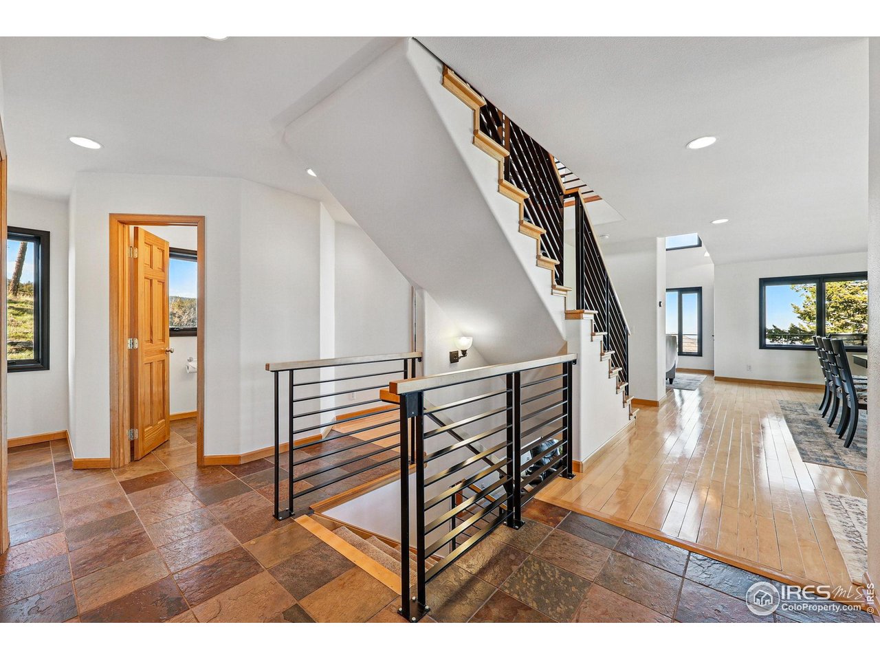 98 Rim Road Boulder, CO 80302 - Photo 6 of 43 Real stone slate tile, beautiful railings, and gleaming hardwood floors