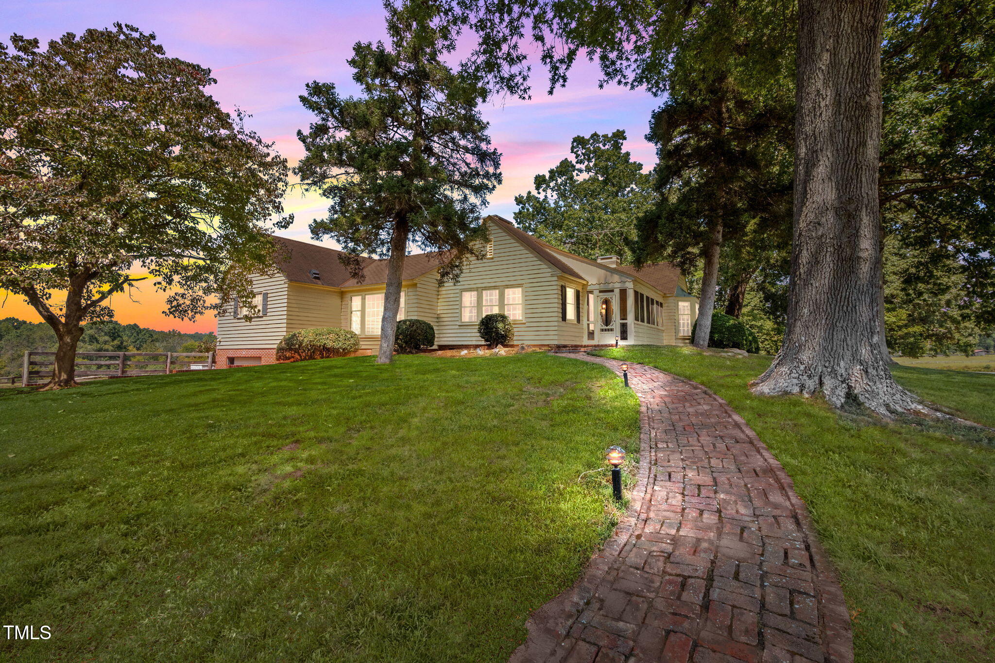 418 Quail Roost Farm Road Rougemont, NC 27572 - Photo 10 of 100 a front view of a house with garden