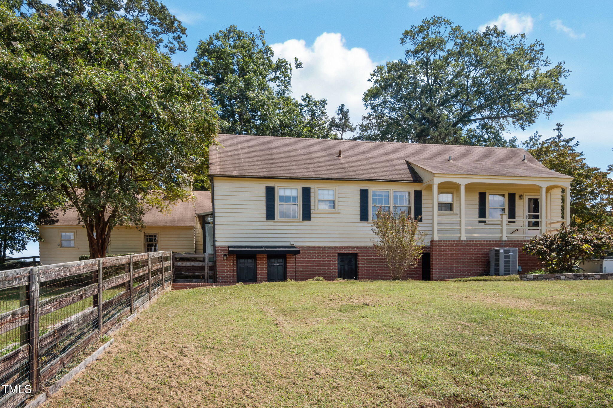 418 Quail Roost Farm Road Rougemont, NC 27572 - Photo 21 of 100 a front view of a house with a yard and trees