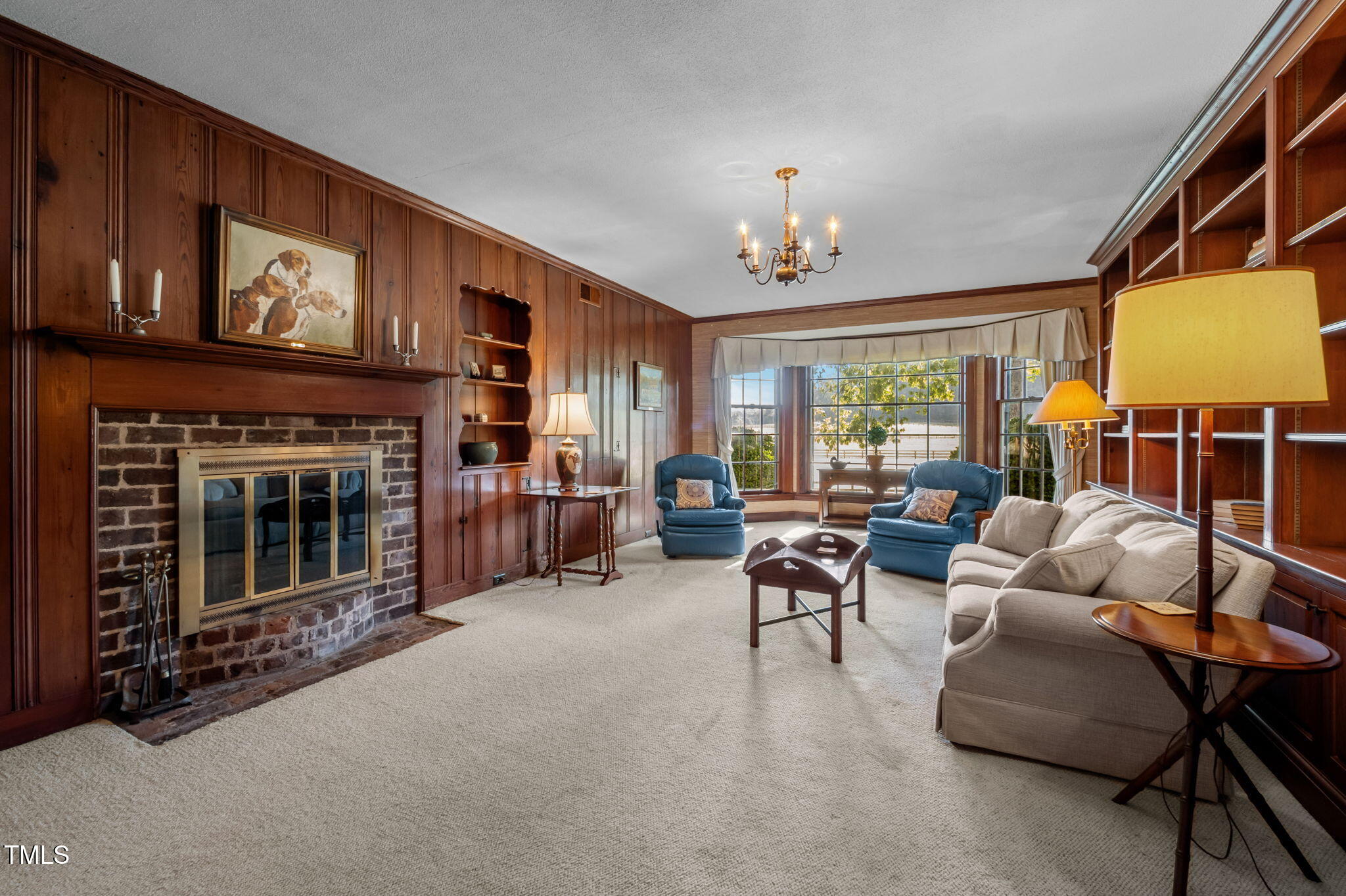 418 Quail Roost Farm Road Rougemont, NC 27572 - Photo 39 of 100 a living room with furniture a fireplace and a large window
