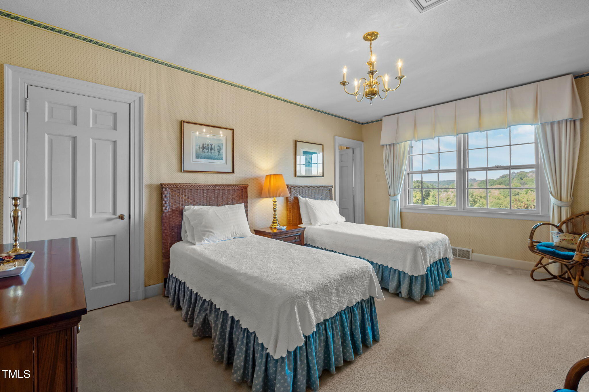 418 Quail Roost Farm Road Rougemont, NC 27572 - Photo 65 of 100 a bedroom with two beds and a chandelier