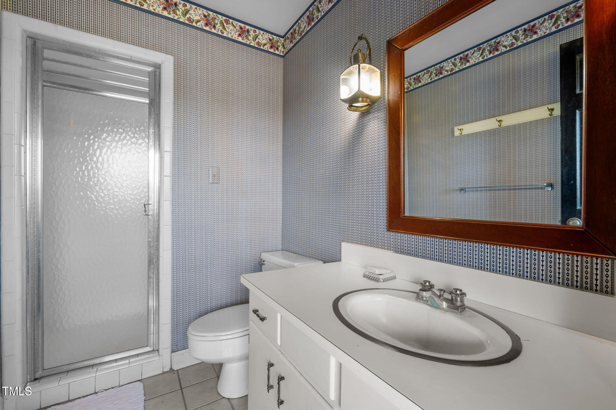 418 Quail Roost Farm Road Rougemont, NC 27572 - Photo 72 of 100 a bathroom with a sink toilet and mirror