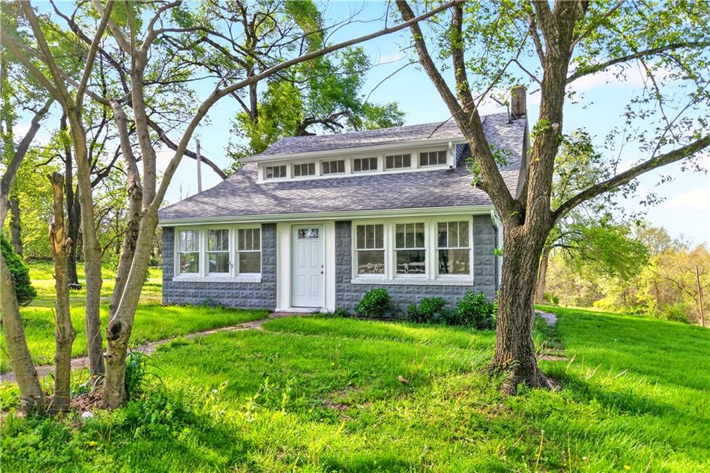 front view of a house with a yard