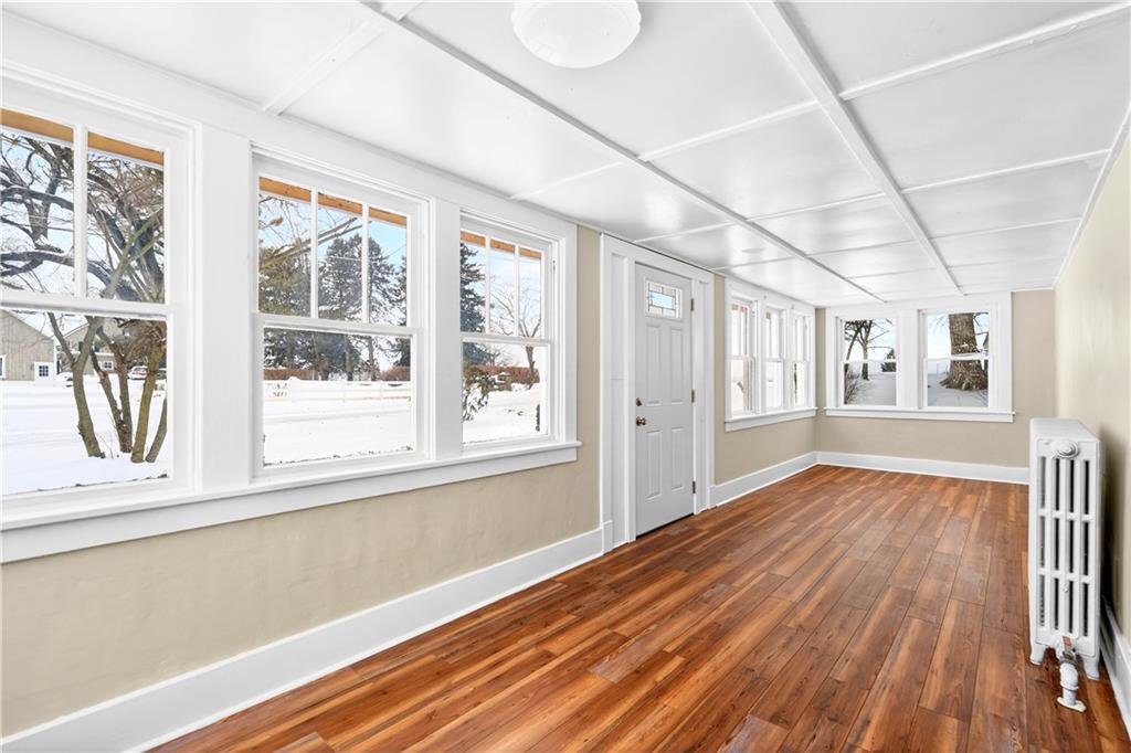 127 Rose Road Mount Pleasant, PA 15666 - Photo 14 of 47 a view of an empty room with wooden floor and a window