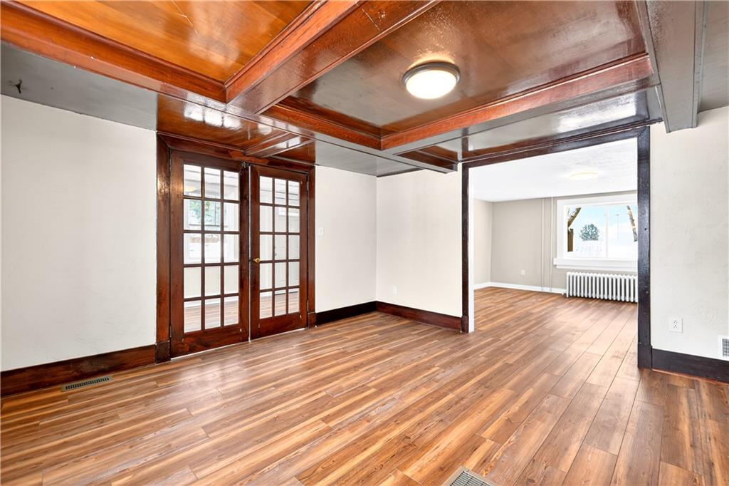 127 Rose Road Mount Pleasant, PA 15666 - Photo 23 of 47 a view of an empty room with wooden floor and a window
