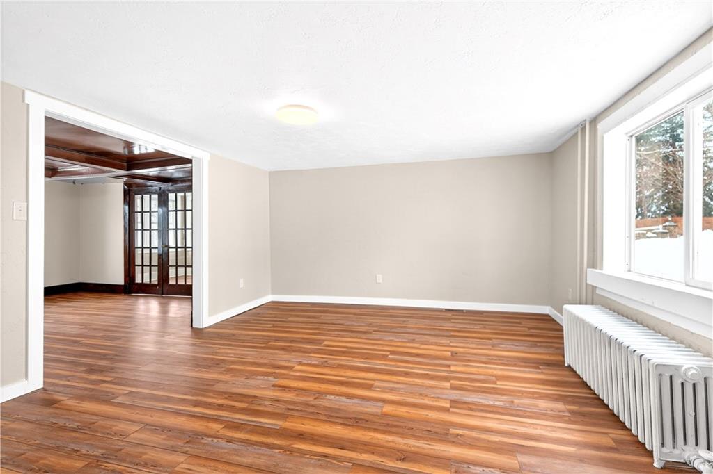 127 Rose Road Mount Pleasant, PA 15666 - Photo 27 of 47 a view of an empty room with wooden floor and a window