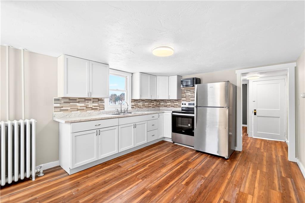 127 Rose Road Mount Pleasant, PA 15666 - Photo 28 of 47 a kitchen with white cabinets and white appliances