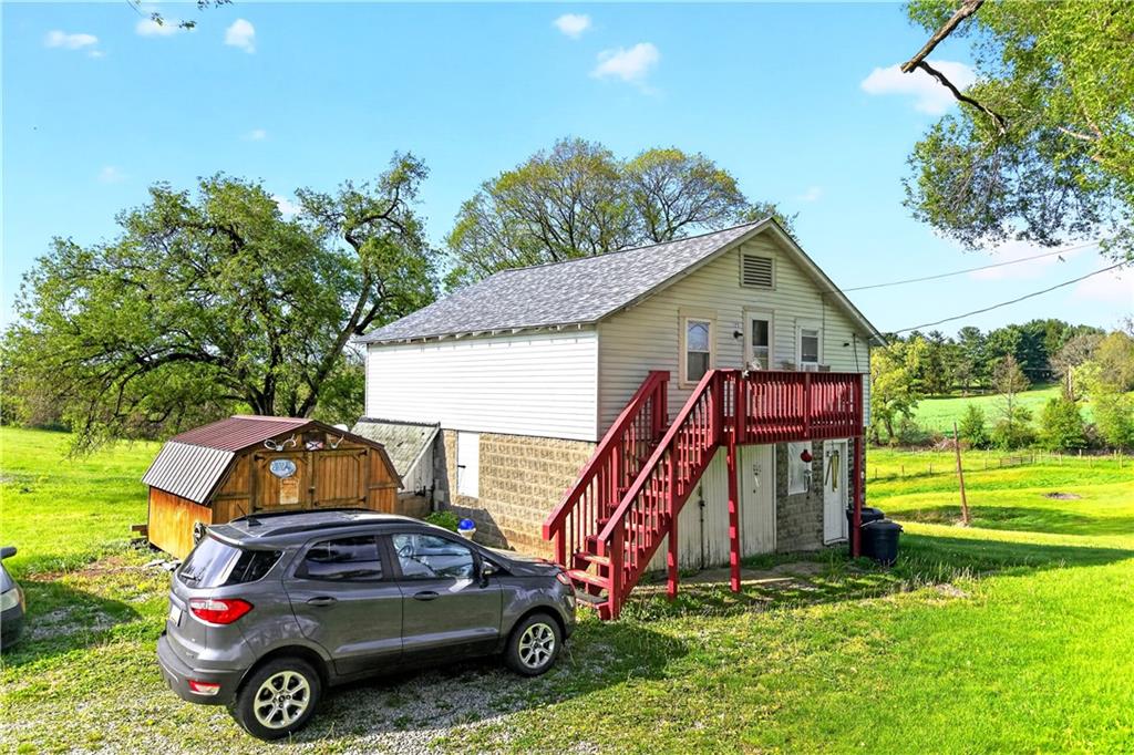 127 Rose Road Mount Pleasant, PA 15666 - Photo 9 of 47 a car parked in front of a house with a yard