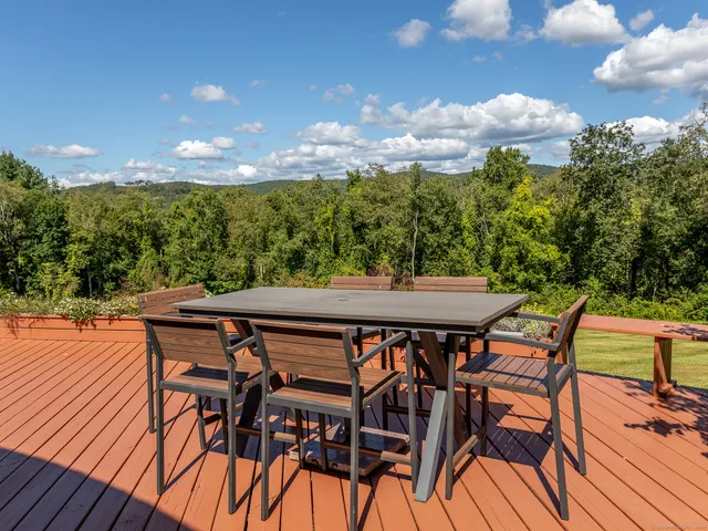 a patio with table and chairs