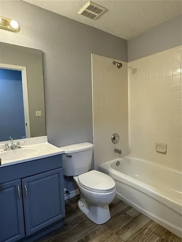 a bathroom with a sink a toilet and a bathtub