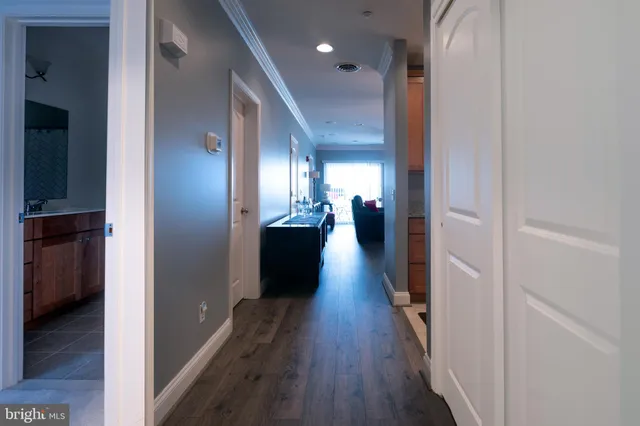 a view of a hallway with the wooden floor