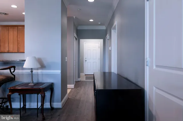 a kitchen with stainless steel appliances granite countertop a stove microwave and cabinets