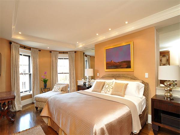 36 Rutland Square Boston, MA 02118 - Photo 11 of 22 a bedroom with a large bed and a window