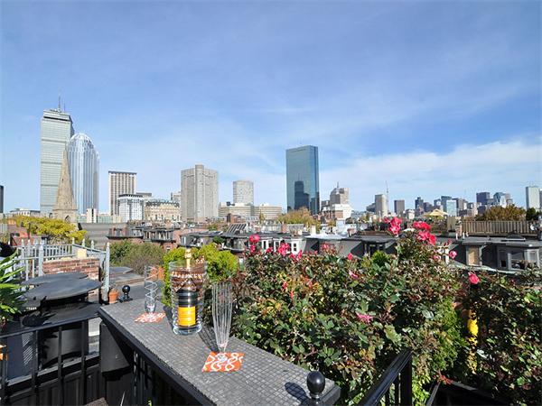36 Rutland Square Boston, MA 02118 - Photo 16 of 22 a view of roof deck with dining table and chairs