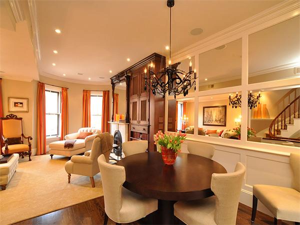 36 Rutland Square Boston, MA 02118 - Photo 4 of 22 a view of a dining room and livingroom with furniture wooden floor a chandelier