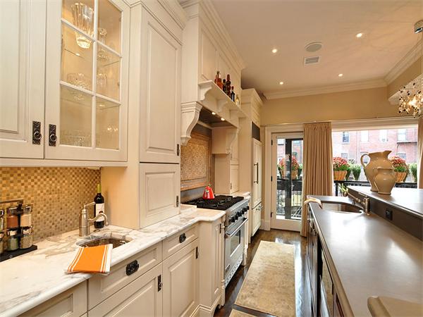 36 Rutland Square Boston, MA 02118 - Photo 5 of 22 a kitchen with stainless steel appliances granite countertop a sink stove and cabinets